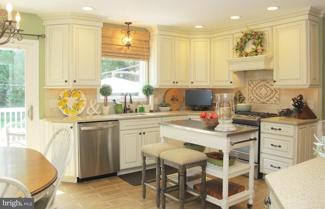 126 Devon Rd, Cinnaminson, NJ 08077 - kitchen featuring appliances with stainless steel finishes, backsplash, a chandelier, cream cabinets, and recessed lighting