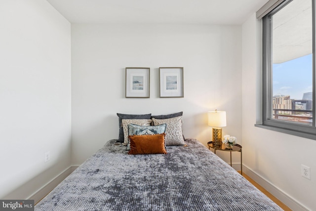 2001 15th St N Unit 1005, Arlington, VA 22201 - bedroom with multiple windows and wood finished floors