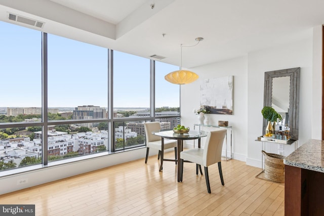2001 15th St N Unit 1005, Arlington, VA 22201 - dining space featuring light wood finished floors, a view of city, and floor to ceiling windows