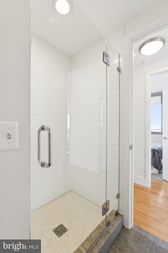 2001 15th St N Unit 1005, Arlington, VA 22201 - bathroom with a stall shower and wood finished floors