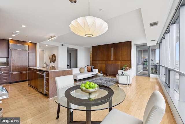 2001 15th St N Unit 1005, Arlington, VA 22201 - dining space with light wood-style flooring and recessed lighting