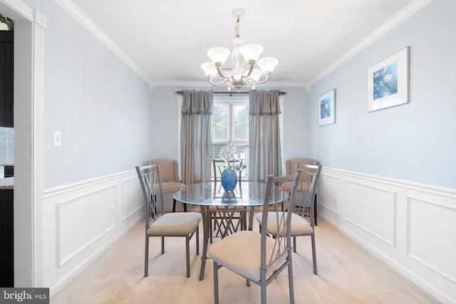 1 Brady Cir, Middletown, DE 19709 - dining space featuring a chandelier, a decorative wall, crown molding, light carpet, and wainscoting