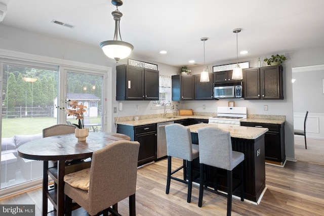1 Brady Cir, Middletown, DE 19709 - kitchen featuring appliances with stainless steel finishes, healthy amount of natural light, a center island, hanging light fixtures, and recessed lighting