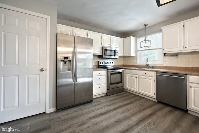 486 Highland Rd, Red Lion, PA 17356 - kitchen featuring stainless steel appliances, a sink, dark wood-style flooring, and white cabinetry