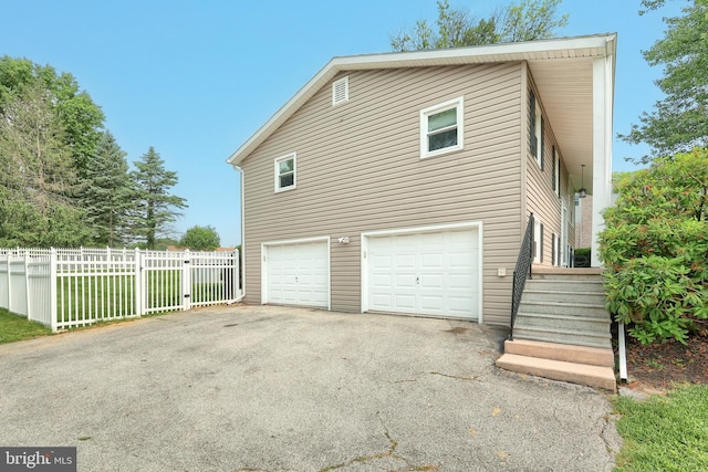 486 Highland Rd, Red Lion, PA 17356 - view of side of home with an attached garage and asphalt driveway
