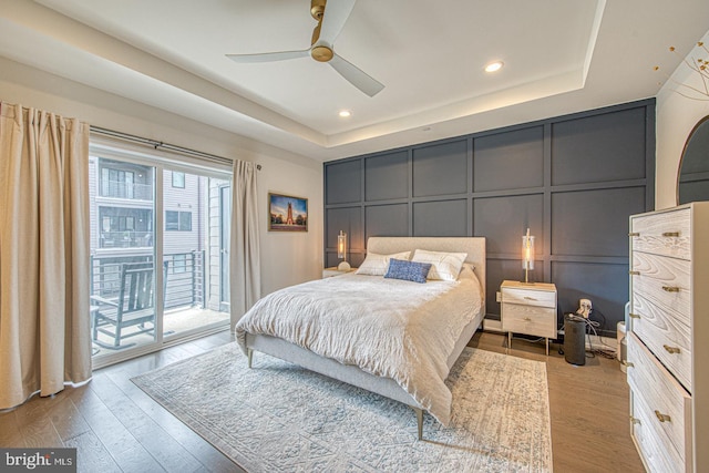1001 Lakeview Ct Unit 1001, King Of Prussia, PA 19406 - bedroom featuring a decorative wall, a tray ceiling, access to outside, wood finished floors, and recessed lighting