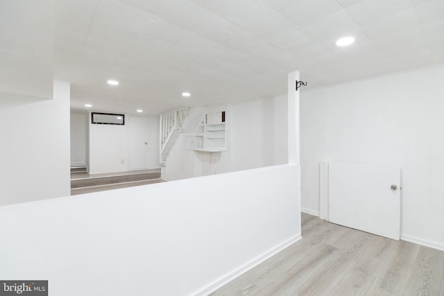 1233 Roosevelt Dr Unit 100, Havertown, PA 19083 - finished below grade area with wood finished floors, stairway, and recessed lighting