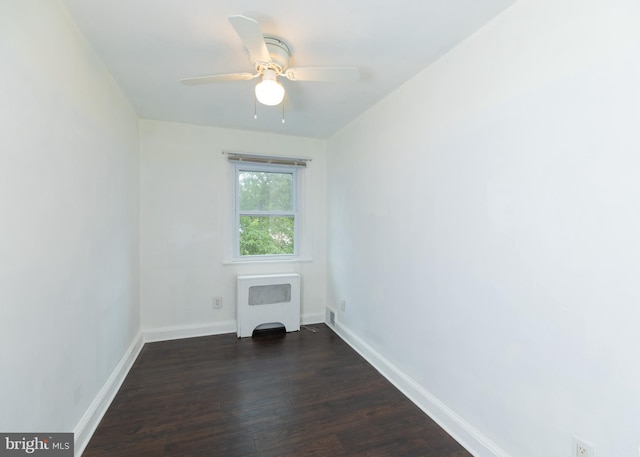 1233 Roosevelt Dr Unit 100, Havertown, PA 19083 - unfurnished living room featuring radiator, dark wood-style flooring, baseboards, and a ceiling fan