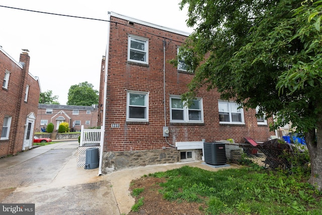 1233 Roosevelt Dr Unit 100, Havertown, PA 19083 - view of property exterior with cooling unit and brick siding
