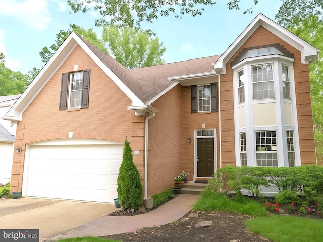 1811 Hyman Ln, Crofton, MD 21114 - traditional home with an attached garage, concrete driveway, brick siding, and a shingled roof