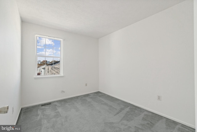 8078 Outing Ave, Pasadena, MD 21122 - spare room featuring carpet floors, baseboards, and a textured ceiling