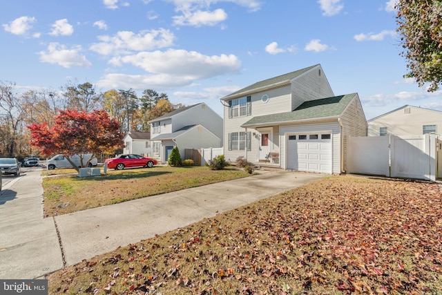 8078 Outing Ave, Pasadena, MD 21122 - traditional-style house featuring concrete driveway, an attached garage, and a gate