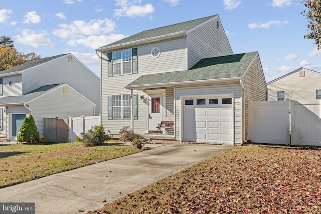 8078 Outing Ave, Pasadena, MD 21122 - traditional-style home featuring a gate, driveway, a garage, and a shingled roof