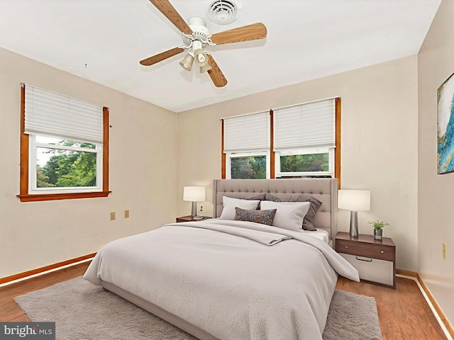10694 Salem Ave, Thurmont, MD 21788 - bedroom with multiple windows, light wood-style flooring, and a ceiling fan