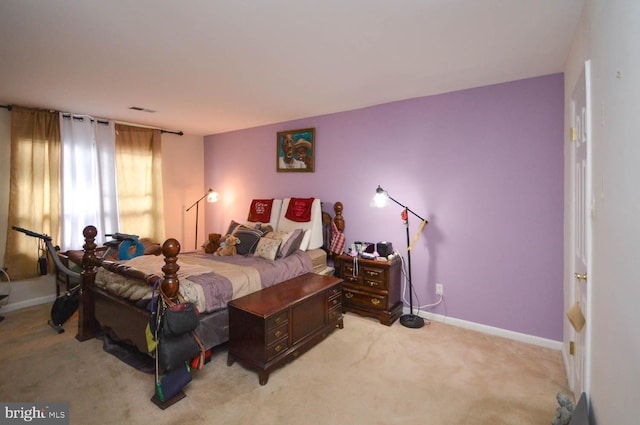 6317 Park Heights Ave Unit 310, Baltimore, MD 21215 - bedroom with light carpet and baseboards