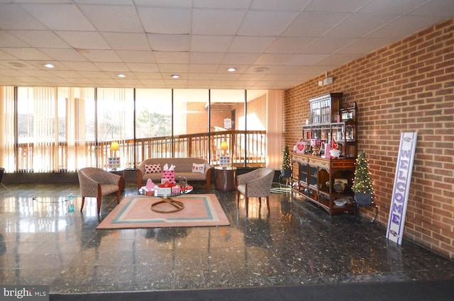 6317 Park Heights Ave Unit 310, Baltimore, MD 21215 - common area with brick wall and a paneled ceiling