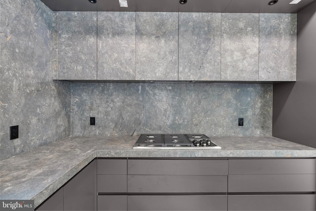 2301 Naudain St, Philadelphia, PA 19146 - kitchen with stainless steel gas stovetop, backsplash, and gray cabinets