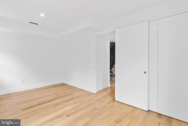 2301 Naudain St, Philadelphia, PA 19146 - unfurnished room featuring wood finished floors, baseboards, and a raised ceiling