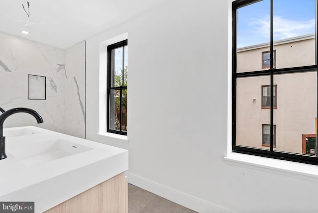 2301 Naudain St, Philadelphia, PA 19146 - bathroom featuring baseboards, vanity, and tile patterned floors
