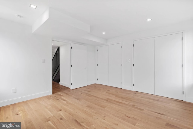 2301 Naudain St, Philadelphia, PA 19146 - unfurnished bedroom with multiple closets, light wood-style flooring, baseboards, and recessed lighting