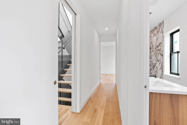 2301 Naudain St, Philadelphia, PA 19146 - hall featuring light wood-type flooring, baseboards, and a sink