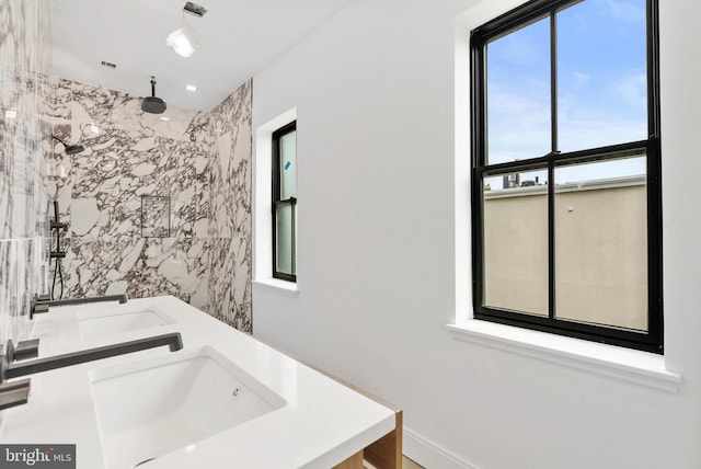 2301 Naudain St, Philadelphia, PA 19146 - full bathroom featuring healthy amount of natural light, a marble finish shower, and double vanity