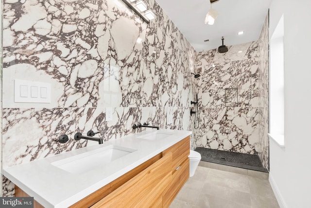 2301 Naudain St, Philadelphia, PA 19146 - full bathroom with a marble finish shower, toilet, tile walls, and double vanity