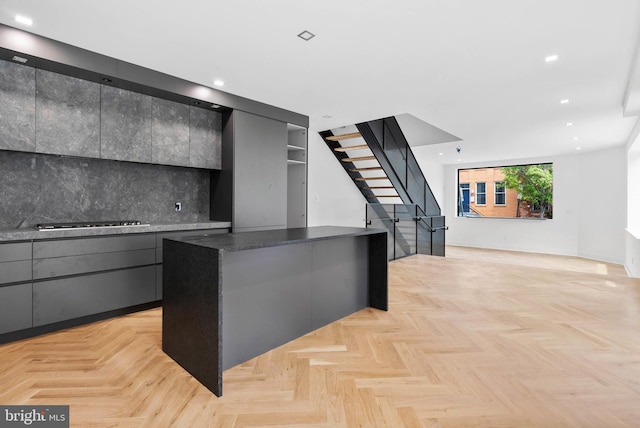 2301 Naudain St, Philadelphia, PA 19146 - kitchen with a center island, gray cabinetry, gas stovetop, modern cabinets, and recessed lighting