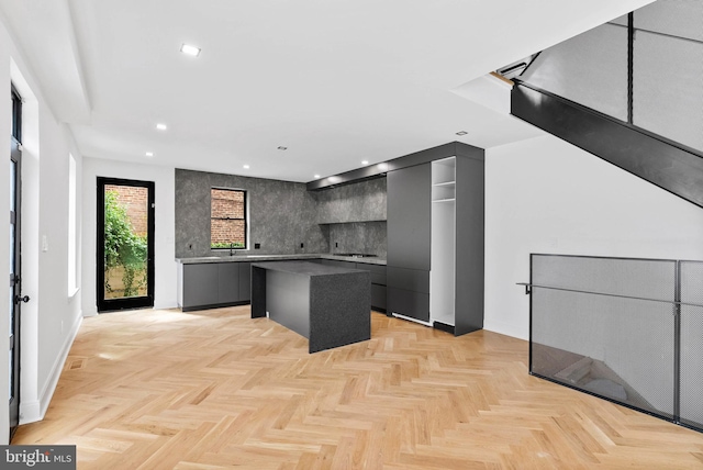 2301 Naudain St, Philadelphia, PA 19146 - kitchen featuring a center island, modern cabinets, gray cabinetry, tasteful backsplash, and recessed lighting