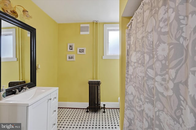 133 S Prospect Ave, Baltimore, MD 21228 - full bathroom featuring baseboards, radiator heating unit, vanity, toilet, and a shower with curtain