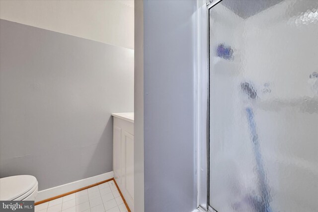 133 S Prospect Ave, Baltimore, MD 21228 - bathroom featuring a shower stall, vanity, toilet, and baseboards