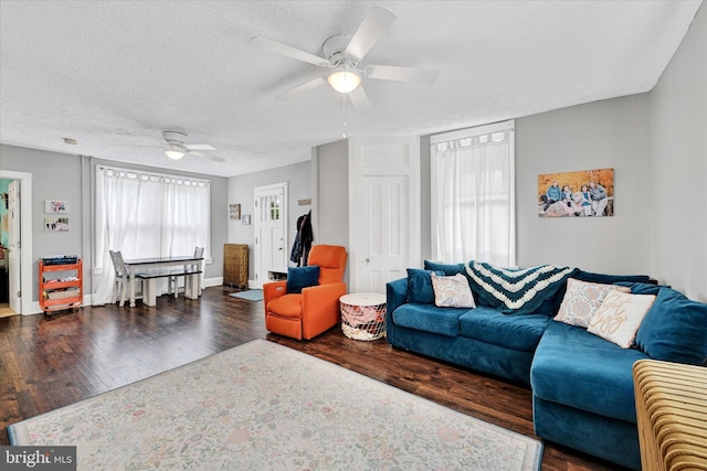 133 S Prospect Ave, Baltimore, MD 21228 - living area with a ceiling fan, wood finished floors, a textured ceiling, and baseboards