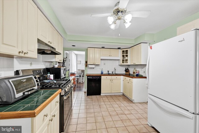 133 S Prospect Ave, Baltimore, MD 21228 - kitchen featuring stainless steel appliances, under cabinet range hood, a sink, ceiling fan, and decorative backsplash