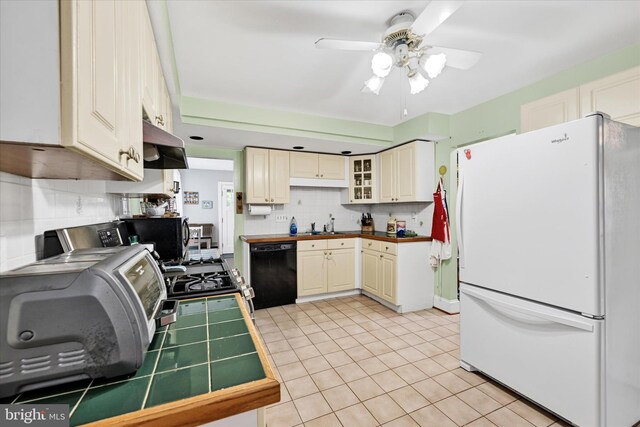 133 S Prospect Ave, Baltimore, MD 21228 - kitchen with black appliances, tile counters, ceiling fan, range hood, and decorative backsplash