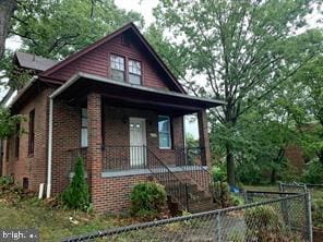 4336 Southern Ave SE, Washington, DC 20019 - view of front of house featuring covered porch and brick siding