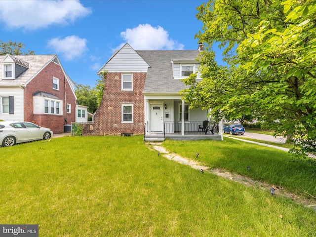 3812 Callaway Ave, Baltimore, MD 21215 - view of front of house featuring a porch, a front yard, and cooling unit