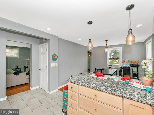 3812 Callaway Ave, Baltimore, MD 21215 - kitchen featuring light brown cabinetry, recessed lighting, baseboards, decorative light fixtures, and stone countertops