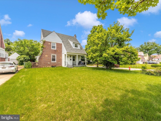 3812 Callaway Ave, Baltimore, MD 21215 - rear view of property with a porch, a lawn, and a chimney