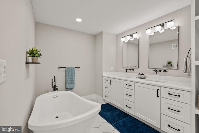 7816 Wendy Ridge Ln, Annandale, VA 22003 - full bath with double vanity, a freestanding bath, tile patterned floors, and recessed lighting