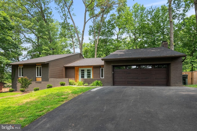 7816 Wendy Ridge Ln, Annandale, VA 22003 - view of front of home featuring brick siding, an attached garage, asphalt driveway, and a chimney