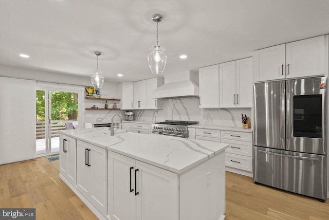 7816 Wendy Ridge Ln, Annandale, VA 22003 - kitchen with stainless steel appliances, premium range hood, white cabinets, light wood-style floors, and recessed lighting