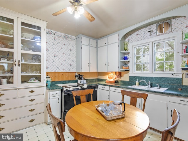 140 Delaware Ave, Laurel, DE 19956 - kitchen with open shelves, range with electric cooktop, light floors, ceiling fan, and white cabinets