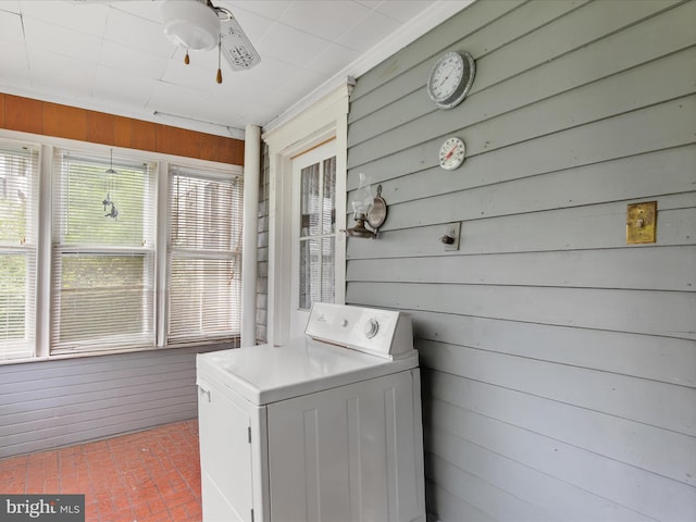140 Delaware Ave, Laurel, DE 19956 - laundry room featuring washer / clothes dryer, brick floors, wood walls, and a ceiling fan