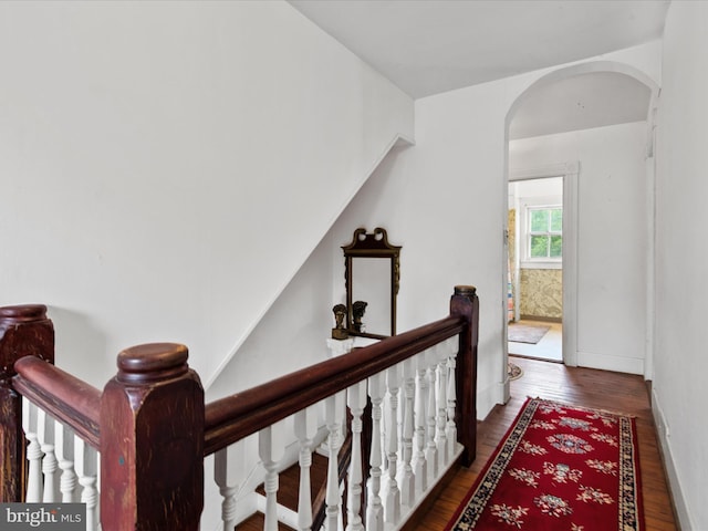 140 Delaware Ave, Laurel, DE 19956 - corridor with an upstairs landing, wood finished floors, and arched walkways