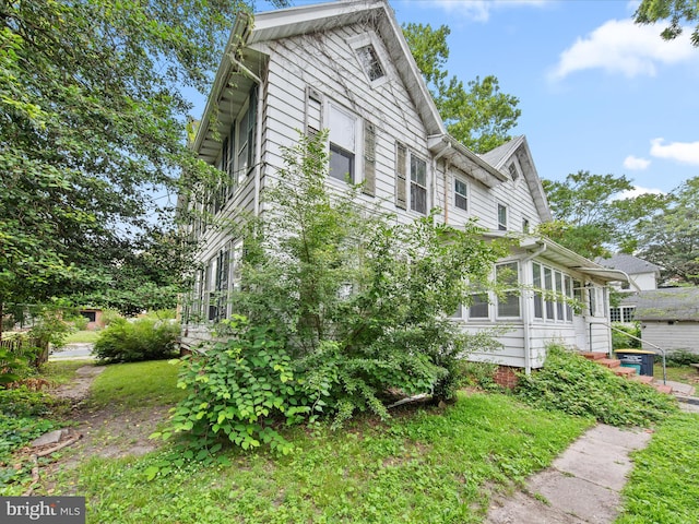 140 Delaware Ave, Laurel, DE 19956 - view of property exterior with a sunroom