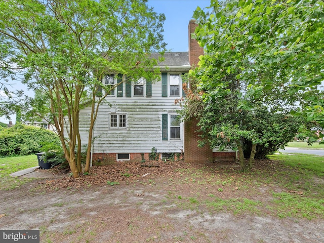 140 Delaware Ave, Laurel, DE 19956 - view of side of home featuring a chimney