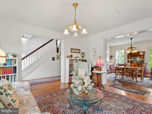 140 Delaware Ave, Laurel, DE 19956 - living room with a chandelier, wood finished floors, and stairs