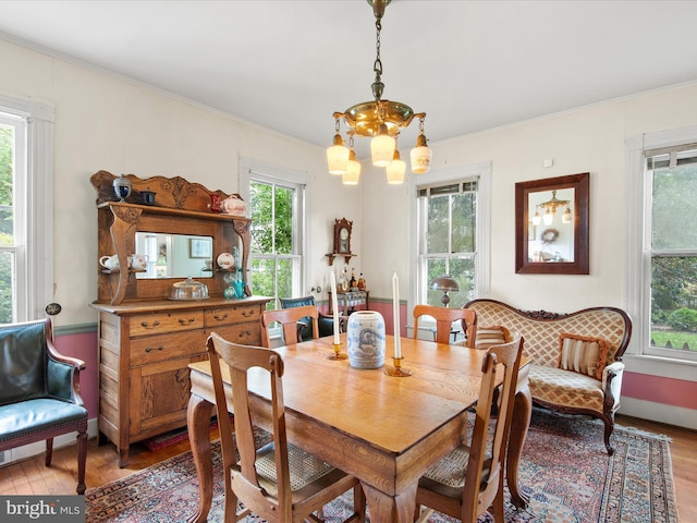 140 Delaware Ave, Laurel, DE 19956 - dining room with light wood-style flooring, a chandelier, and ornamental molding