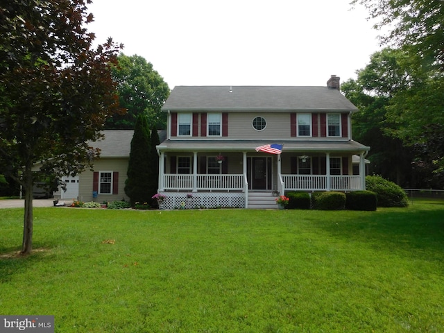 215 Cedar Beach Dr, Prince Frederick, MD 20678 - colonial-style house featuring covered porch, a chimney, a front yard, and an attached garage