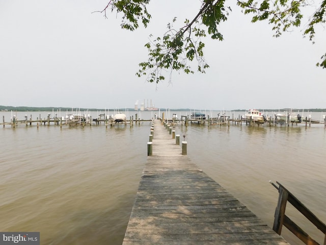 215 Cedar Beach Dr, Prince Frederick, MD 20678 - dock featuring a water view and boat lift